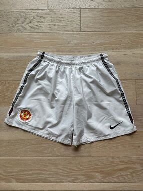 Mens Nike Dri Fit White Soccer Shorts with Black Trim and Manchester United Logo